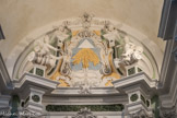 <center>Eglise abbatiale de St Pons</center>Au centre du médaillon frontal, le triangle trinitaire rayonnant vers le bas.