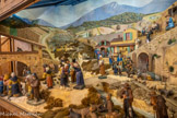 <center>Jouques.</center> Eglise Saint Pierre. La crèche. On remarquera tout particulièrement les attitudes et les expressions des personnages, le rappel dans le décor de quelques éléments typiques du village et de ses collines.