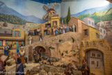 <center>Jouques.</center> Eglise Saint Pierre. La crèche. Pour éviter chaque année, avant Noël, la manipulation de ces très lourds santons, qui entraînait au fil des, ans de nombreuses dégradations, le Père Louis Van Den Bruggen, alors curé du village, confia au neveu de Jean, la restauration des santons et la réalisation d’une exposition permanente. 1992 a vu l’inauguration de cette crèche par Monseigneur Panafieu, alors archevêque d’Aix et Arles.