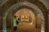 <center>Abbaye de Saint-Martin-du-Canigou</center>L'abbatiale possède, à cause des contraintes du site, deux églises superposées, ce qui est très rare, et une chapelle haute dans un clocher indépendant comme on en trouve en Italie. L'église inférieure presque enterrée et creusée en partie dans le rocher est dédiée à la Vierge Marie. Cette église en partie souterraine ne dépasse pas les trois mètres de hauteur avec un vaisseau central de 3,10 m de largeur et des collatéraux de 2,20 m. Les six travées égales et juxtaposées sont couvertes en berceau avec des arcs doubleaux sur des piliers cruciformes