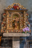 <center>L'église Saint-Jacques de Villefranche-de-Conflent</center>Retable de Notre-Dame-de-Vie. Bois, 1715.
Joseph Sunyer, en 1715, fît pour l’une des Chapelles latérales de l’église Sant-Pere de la Roca une Vierge avec son petit retable qui est un parfait modèle de ce que l’on appelle «le baroque roussillonnais », avec ses colonnes torsadées, ses volutes qui l’entourent entièrement, sa profusion de motifs sculptés, fleurs, feuilles de fruits. Au centre, s'élève une nichel, couverte par une coquille en arc de cercle ; elle abrite une statue de la Vierge à l'Enfant debout. Elle s'insère dans un panneau rectangulaire orné dans les écoinçons de deux têtes d'angelots dans des nuées. La Vierge se tient debout, légèrement déhanchée portant l'Enfant sur son bras gauche. Elle a un visage très jeune avec des yeux bleux et des cheveux châtains, ondulés ramenés en arrière. L'Enfant a une chevelure bouclée, châtain clair, avec un grand front largement dégagé sur les côtés. La Vierge est pieds nus, vêtue d'une robe ample, très simple, ceinturée à la taille. Elle porte par-dessus un manteau lui couvrant l'arrière de la tête, ramené sur les épaules et drapé autour du bras gauche. Il revient sous les bras et est maintenu devant, au niveau des hanches, par une broche en pointe de diamant ; le bas se soulève vers la droite comme soufflé par le vent. 
Dans le couronnement, Dieu Le Père apparaît à mi-corps,  présenté comme un vieillard, un peu dégarni, avec une longue barbe ondulée. Tandis qu'il regarde vers le bas, sur sa gauche, il pose sa main gauche sur le globe terrestre et bénit de la droite. Il est drapé dans un manteau rouge.