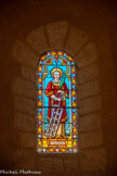 <center>Saint-Laurent-la-Vernède.</center>  Il y a quatre fenêtres dans les bas-côtés. Elles sont à plein cintre sans archivolte. Les vitraux sont de J. Dezeuze, de Montpelliet,1903. St Laurent avec le gril et la palme du martyr.