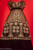 <center>Paul Poiret, la mode est une fête</center>Paul Poiret
Robe du soir, 1910.
Satin de soie, mousseline de soie brodée de tubes de verre et velours de soie.
Paris, musée des Arts décoratifs, dépôt UFAC, 1905. Don M. Bienvenu