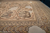 <center>PAVEMENT DE MOSAÏQUE, DÉPOSÉ DE DAYR AL-BALAH</center>Un éléphant, une brebis. A droite : L'inscription commémore l’achèvement de travaux det construction, de décoration ou de restauration d’une église, «au mois d’Artémision de l’an 646» (du calendrier julien).
Inscription : Saint (est) ton temple admirable en justice Seigneur. Par les soins de Georges, très glorieux illustre et avec l'aide de Dieu, pantepitropos, et de Philippe, très magnifique comte et epitropos, a été effectué tout l'ouvrage, au mois d’Artémision de l’an 646.