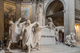 <center>Le choeur.</center>Monument à la Convention nationale (1913)
François-Léon Sicard (1862-1934). Le groupe sculpté prénommé La Convention nationale de François Sicard, est une commande publique passée en 1913 pour célébrer l’avènement de la Ière République. Placée à l’endroit même où se situe habituellement l’autel dans une église, il y a, à travers cette œuvre, la volonté de réaffirmer la République et ses valeurs en ce tournant du XXe siècle. Moins de 10 ans après la loi sur la séparation de l’Église et de l’État de 1905, cette sculpture est une façon de matérialiser l’assise de la République Française. Au centre de cette sculpture monumentale en pierre, la Convention nationale apparaît sous les traits d’une jeune femme coiffée du bonnet phrygien et portant l’épée abaissée. À gauche, un groupe de députés prêtent serment le bras levé vers la Convention. À droite, des soldats symbolisent l’armée de la République : deux jeunes tambours  précèdent de vieux fantassins qui entourent un officier général à cheval (le général Hoche).