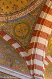 <center>Les pendentifs de la coupole de l'entrée</center>La vigne chargée de raisins. Vigne mystique qui a reçu la grappe de l'immortalité : saint André de Crète (+ 740).
