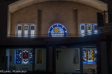 <center>L'église Saint-Louis.</center> Les vitraux ont été réalisés par le maître verrier Pierre Dindeleux, à partir de pavés de verre fabriqué dans les ateliers de Chiri. Les six rosaces de la nef ont toutes trait à Saint Louis et ses croisades.