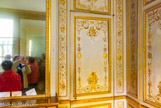 <center>Cabinet de garde-robe de Louis XVI.</center> Les délicates boiseries sont dues au ciseau d'Antoine Rousseau. Elles datent de 1788 et ont pour sujet les sciences, les arts, la guerre, la marine, l'agriculture et le commerce.