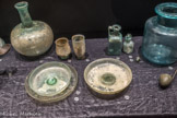 <center></center>54. Grande cruche
Verre soufflé Tyr (Liban) Ier siècle <br>
56. Plat à côtes
Verre soufflé Tyr (Liban) IVe siècle <br>
57. Assiette
Verre soufflé Chypre
vers 150 <br>
58. Assiette
Verre soufflé Sans prov.
Epoque romaine <br>
59. Plat sur pied Verre soufflé Syrie
Epoque romaine <br>
60. Gobelet caréné Verre soufflé Avignon
vers 150 <br>
61. Haut gobelet Verre soufflé Orange
IIe siècle <br>
62. Bouteille Verre soufflé Arles
IIe siècle <br>
63. Bouteille hexagonale
Verre soufflé Arles IIe siècle <br>
64. Bouchons Verre soufflé Arles
IIe siècle <br>
65. Bouteille cylindrique Verre soufflé Ailes
ler siècle <br>