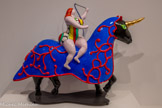 <center>The Unicorn</center>1994.
Résine polyester peinte.
(peinture polyurethane et flash vernis) sur socle en métal. NIKI CHARITABLE ART FOUNDATION. <br>
Déjà connue dans la Grèce antique, la licorne l’est surtout au Moyen-Âge qui voit la diffusion de son mythe comme animal bénéfique et salvateur. Dans les tapisseries et les enluminures médiévales, elle symbolise la pureté puisque, selon la légende, seule la présence d’une vierge permet de la capturer. Sa corne possède précieuses propriétés thérapeutiques : elle offre un antidote a tout poison mortel. Dans l’œuvre de Saint Phalle qui représente une femme chevauchant une licorne, l’association avec la figure féminine va dans le sens de la force et de la prospérité plus que de la pureté comme dans l’iconographie médiévale originelle.