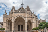 <center>Beaune </center>Le cloître et la salle capitulaire sont reconstruits au 13e siècle par le chapitre, comptant trente chanoines à cette époque. En 1265 eut lieu la translation des reliques de saint Flocel et de saint Herné de l’ancienne église Saint-Flocel à Notre-Dame. En 1273, l’église est incendiée par le feu. Elle est restaurée dans le goût gothique et renforcée par des arcs-boutants à la fin du 13e siècle et au début du 14e siècle. A la fin du Moyen-Age, l’église est complétée par un nouveau porche gothique et par des séries de chapelles latérales. Les cardinaux Rolin dotent l’église d’œuvres d’art de style flamboyant et Renaissance de première importance. Un nouvel incendie en 1575 détruisit la flèche du clocher qui est reconstruite par Hugues Sambin.
Notre-Dame fut en grande partie épargnée à la Révolution. Elle fut classée Monument Historique en 1840 et devint église paroissiale. Une campagne de restauration de 1860 à 1863 fut menée par Maurice Ouradou sur les devis de Viollet le Duc datant de 1844. L’église fut nommée basilique mineure en 1958 par le pape Pie XII.