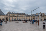 <center>Place de la Libération.</center>À la Révolution, la place fut rebaptisée place d'Armes et la statue de Louis XIV, détruite le 15 août 1792. La place, rebaptisée place Impériale sous l'Empire en 1804, redevint place Royale à la Restauration, en 1814, avant de retrouver une seconde et dernière fois le nom de place d'Armes en 1831, sous la monarchie de Juillet. En 1941, la municipalité de Dijon donna à la place le nom du Maréchal Pétain. Elle fut rebaptisée place de la Libération à la libération, en septembre 1944.