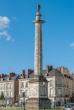 <center>Place Maréchal Foch. </center> On la nomme communément place Louis XVI car la colonne érigée en 1790 en son centre porte l'une des rares figures de ce dernier encore visible en France.