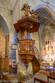 <center>Vias : l'église Saint-Jean-Baptiste </center>Chaire avec abat voix et panneaux sculptés, rampe en fer forgé de style Louis XV.