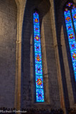 <center>Vias : l'église Saint-Jean-Baptiste </center>Les vitraux, nombreux et colorés, datent de 1951. Ils remplacent ceux de 1850 détruits pendant la Seconde Guerre Mondiale.