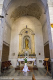<center>L'église Saint-Sauveur</center> Statue de st Benoit d'Aniane, portant la maquette de l'abbaye.