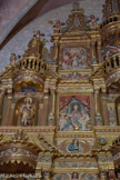 <center>Retable de Baixas.</center>Satue de saint Jean-Baptiste, avec l'agneau de Dieu sur le livre des prophéties. A droite, la présentation au temple et la cironcision. Le rabin ressemble à un évêque mitré pour affirmer, suivant la doctrine catholique, que le sacerdoce est de droit divin. Au dessus, la Vierge couronnée par la Sainte Trinité. Au dessous, l'homme.