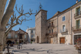 <center>Saint Jean de Fos</center> Place de la mairie. La tour de L’horloge 
Construite comme tour défensive, elle fut édifiée au début de la construction du village au 8e siècle. Elle fut aménagée de 6 meurtrières et donnait accès à l’entrée du village. Au XIIe siècle en même temps que l’édification des remparts la tour eut droit à un autre étage. Bien plus tard elle fut équipée d’une horloge. En 1911 la préfecture autorise l’installation d’une horloge à remontage huitaine. Elle doit être remontée toute les semaines et marche encore parfaitement bien aujourd’hui.
Un clocher en fer forgé appelé en Languedoc un ’’Campanile’’, fait office de carillon pour sonner les heures.