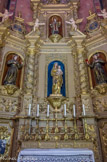 <center>La cathédrale Saint-Jean-Baptiste.</center>Chapelle de Notre-Dame du Mont Carmel. Au centre la Vierge présente le scapulaire, symbole de protection, que les affiliés portent sous leurs vêtements.
De part et d’autre, deux saints jésuites dont la canonisation donna lieu en 1727 à des fêtes marquantes à Perpignan : Saint Stanislas Kostka (1550 – 1568), novice jésuite polonais et Saint Louis de Gonzague (1568 – 1591. Au-dessus de la niche centrale Saint Étienne tenant dans sa main la palme du martyre et de l’autre un livre supportant des pierres qui rappellent qu’Étienne mourut lapidé.