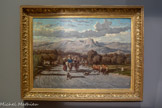 <center>Route d’Antibes à Nice</center>Emile Loubon.
Aix-en-Provence, 1809 - Marseille, 1863.
Huile sur toile.
La route est le lieu primordial de la peinture de Loubon. Elle relie les êtres et les lieux. Bêtes et hommes la parcourent inlassablement, témoins d'une économie rurale faite de déplacements, de colportages ou de transhumances. Elle sert de scène idéale à Loubon qui a la passion du mouvement. Ses paysages sont pensés comme de vastes panoramas, quel que soit le format du tableau, dans une lumière claire que la critique décrit souvent comme blafarde. Au premier plan la forte projection des ombres et les ornières sur le sol poudreux sont autant de signatures du peintre. Elles seront reprises par les peintres du Midi comme un ultime hommage encore à la fin du siècle.
