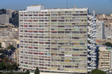 <center>Le Brasilia.</center>L'unité d'habitation le Brasilia créée par l'architecte Fernand Boukobza fut achevé en 1967, il a le label Patrimoine du XXe siècle. Avec plus de vingt étages, l’immeuble ouvre sa courbe concave plein nord afin d’obtenir le plus grand développé de façade au sud. Cette orientation s’oppose à celle de la Cité Radieuse liée à son axe héliothermique, très peu adapté aux conditions climatiques de la région (est et ouest en soleil bas). Néanmoins l’architecte s’est volontairement inspiré des idées de Le Corbusier sur plusieurs points. Les pilotis abritent l’unique entrée en rez-de-chaussée d’où part une batterie d’ascenseurs desservant les appartements par onze coursives intérieures. Les appartements eux-mêmes sont en duplex traversant, orientés nord-sud. Enfin l’élément le plus significatif du Brasilia est son escalier de secours. S’il emprunte encore à la Cité Radieuse, il est l’expression d’une plus grande liberté plastique transformant un élément fonctionnel en véritable objet sculptural.