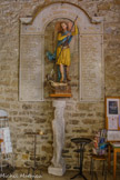 <center>L'église paroissiale Saint-Sauveur Saint-Etienne </center>Statue de Saint-Michel, plâtre polychrome, 19e siècle. Socle sculpté le pénitent, Jean-Pierre de Kock 1980.