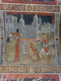 <center>Romans-sur-Isère. </center> Collégiale Saint-Barnard. Une arcade est décorée par des fresques du XVe siècle représentant la légende des saints viennois Exupère, Félicien et Séverin (les trois doms) ; on peut y voir le palais des papes à Avignon avec les trois Saints devant le Pape.